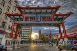 The Chinatown Gateway in Seattle's International District features a stunning backdrop of blue clouds and a sunset. International District Chinatown Community Center concept.