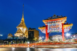 The Chinatown gate in Yaowarat, Bangkok, displays "Sheng Shou Wu Jiang," meaning "Long Live the King." Concept, famous landmarks in Chinatown.